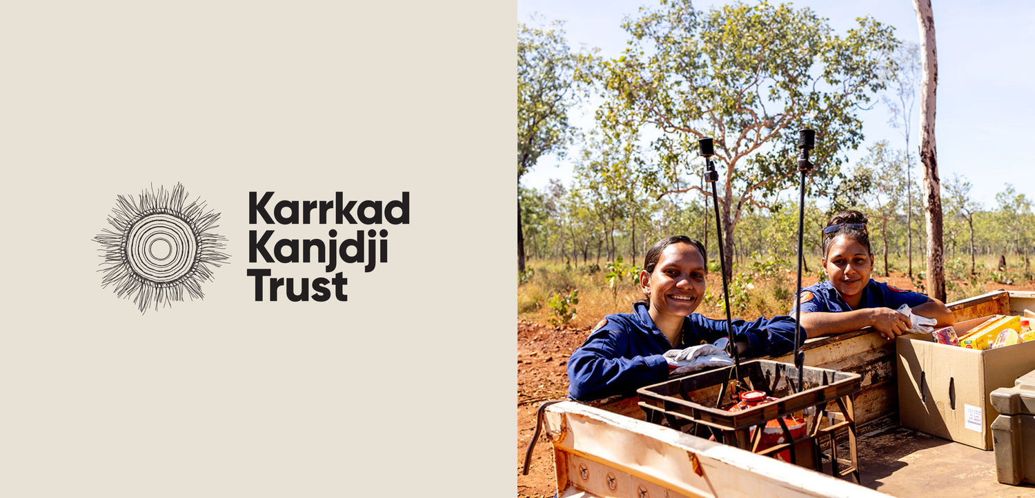 Logo of Karrkad Kanjdji Trust alongside two women in the field, working on conservation efforts in a natural landscape