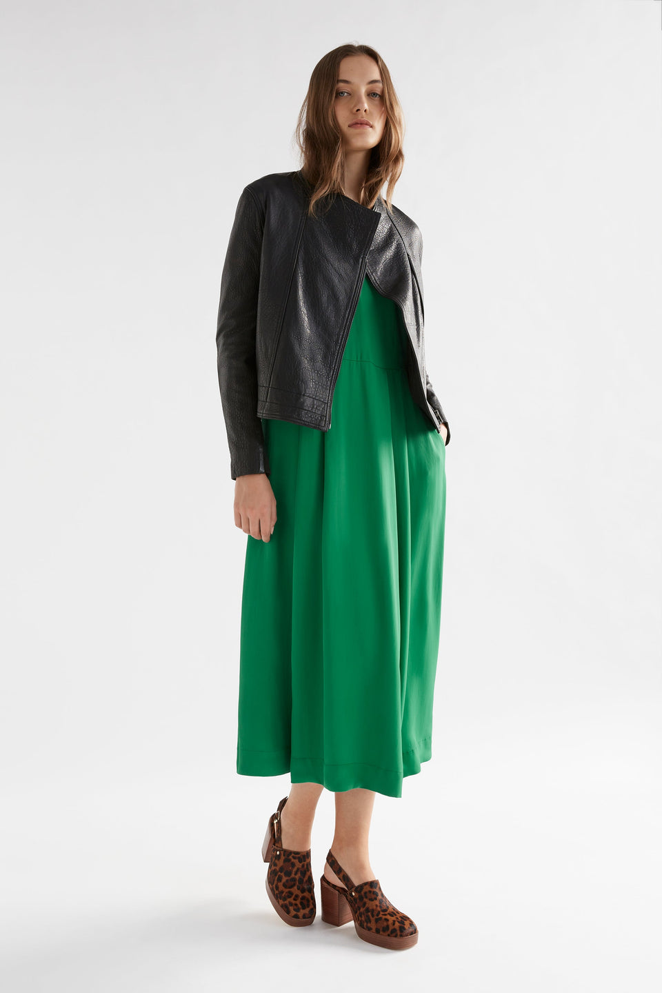 Deili V-Neck Flutter Sleeve A-line Dress Model Front with Lader Leather Jacket | JEWEL GREEN