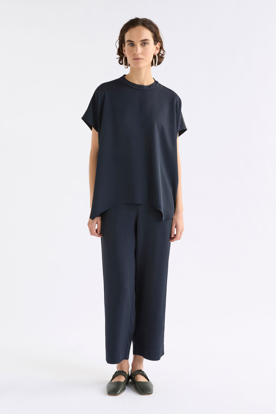 Hullu Relaxed Short Sleeve High Neck Top with Handkerchief Hem Model Front full body | NAVY