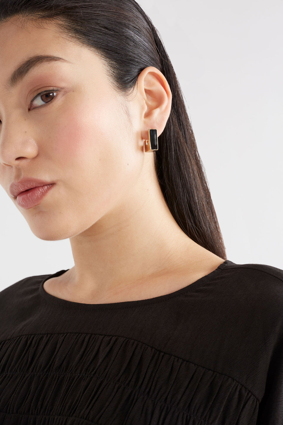 Anas Small Chunky Lightweight Metal and Enamel Square Stud Hoop Earring Model crop | BLACK