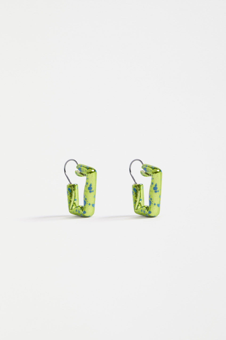 The Oban Square Hoop Earring features a bold geometric shape with a glistening bronze base and contrasting enamel splatter finish | ARTICHOKE