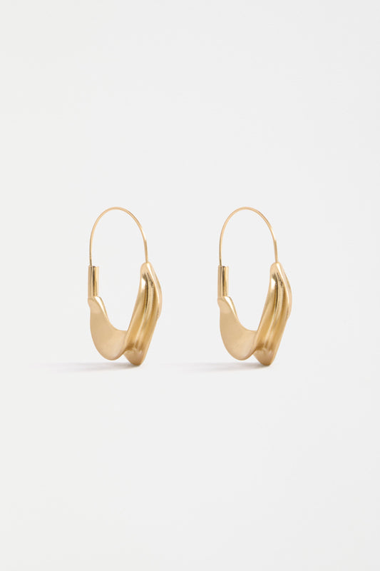 The Siita Hoop Earring features a sculptural petal-shaped base and fine closure for a modern take on the classic hoop | GOLD