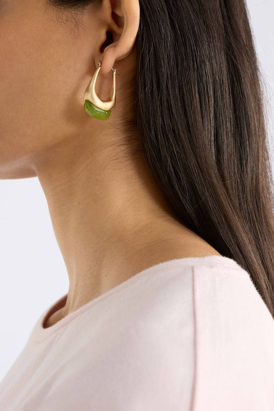 The Korvvo Long Hoop Earring features an elongated sculptural hoop with a coloured flecked glass bead model | LILAC