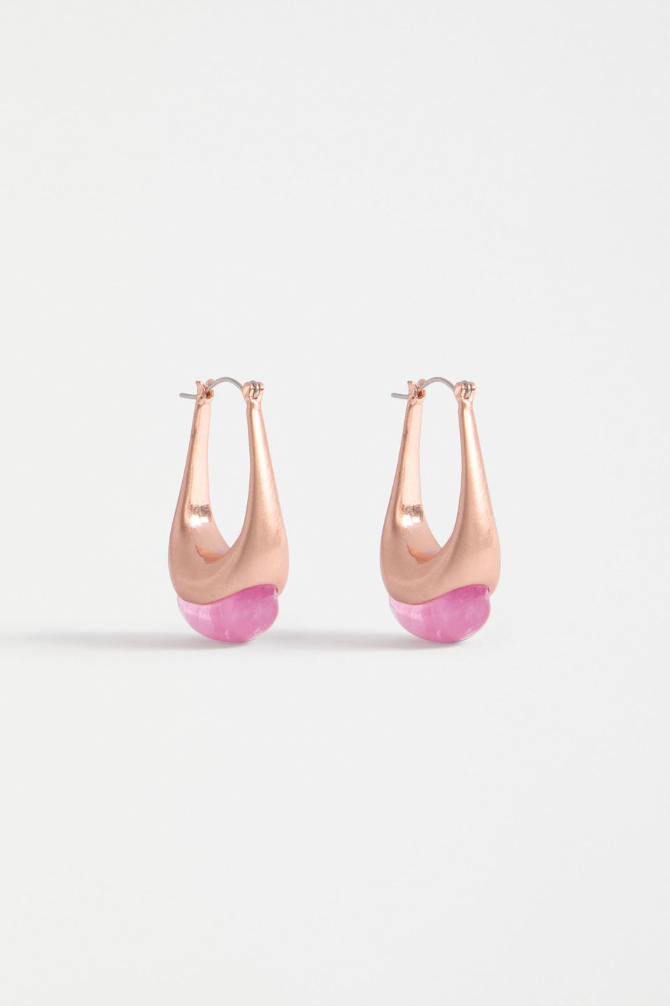 The Korvvo Long Hoop Earring features an elongated sculptural hoop with a coloured flecked glass bead, adding bold elegance to evening looks | LILAC