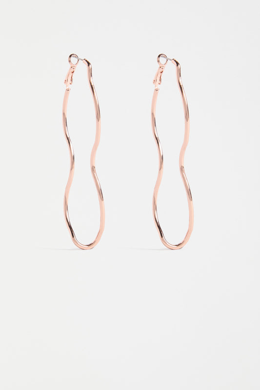 The Svel Long Hoop Earring features a dramatically elongated curved design in fine, lightweight metal for a bold yet refined statement | ROSE GOLD