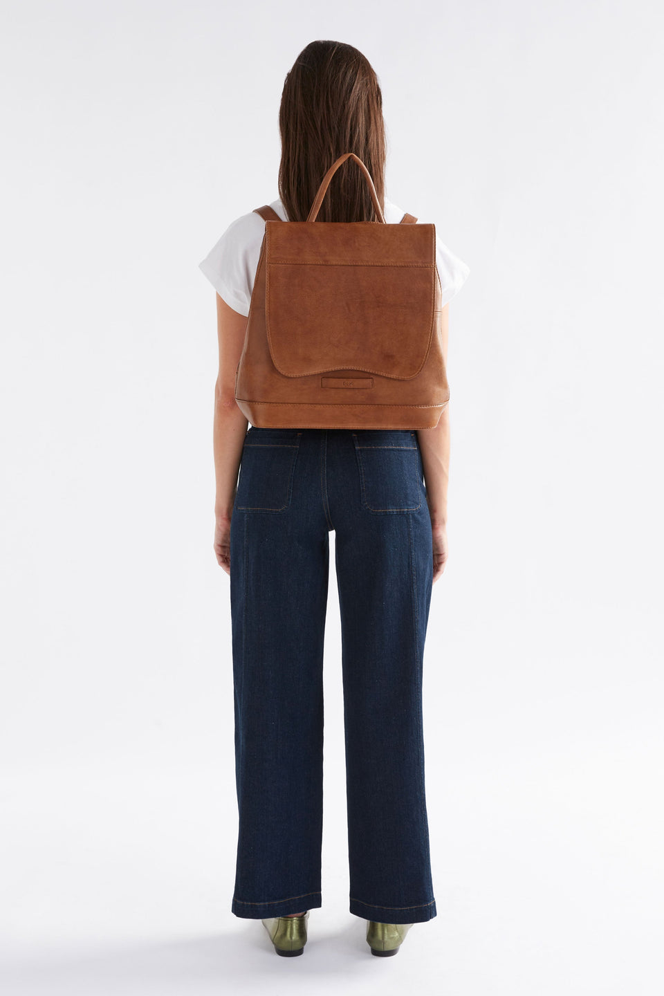 Forpa Zip-Up and Flap Leather Backpack Model on back | BLACK
