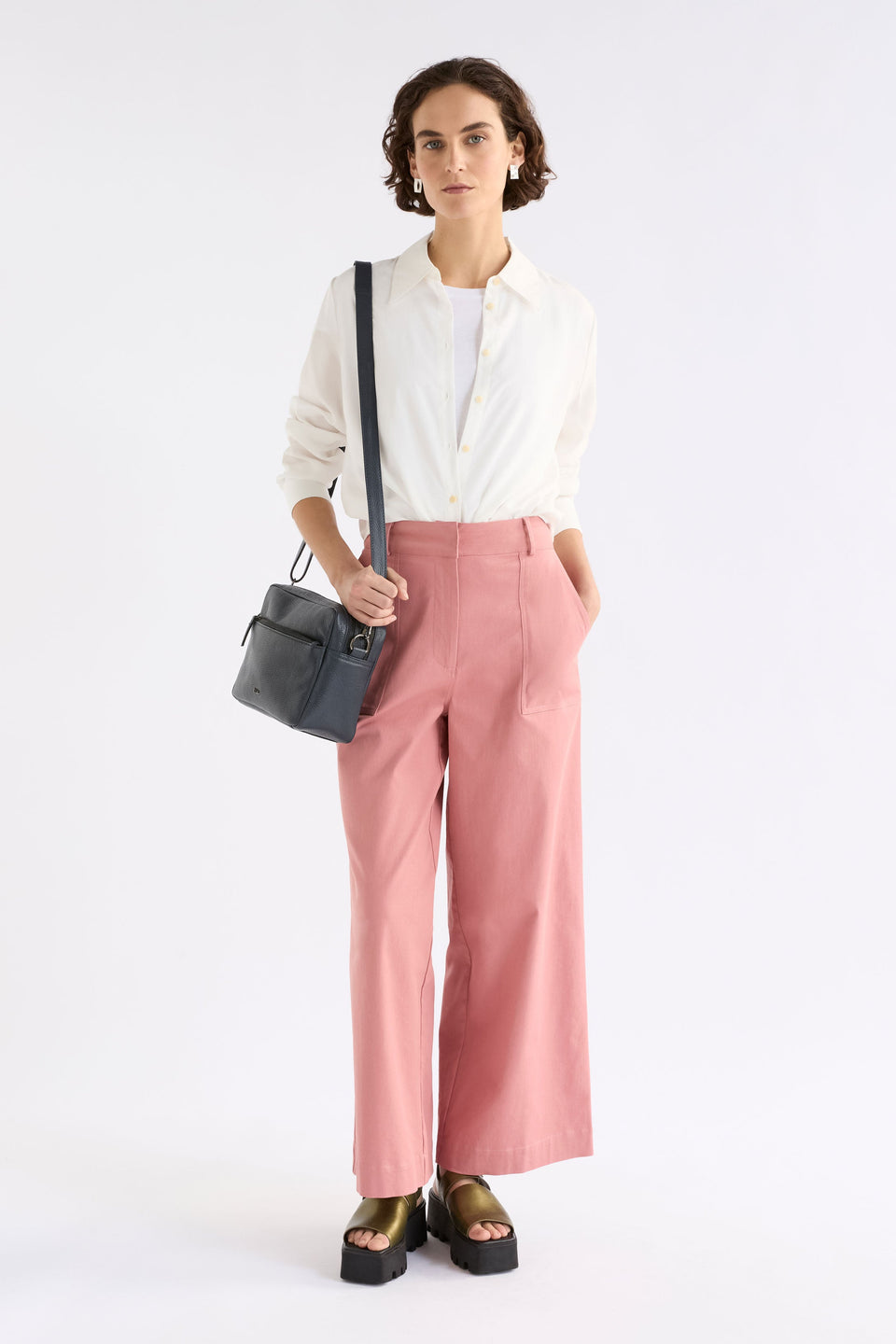 Olvi Crossbody Bag on styled model with zip pocket and strap | NAVY
