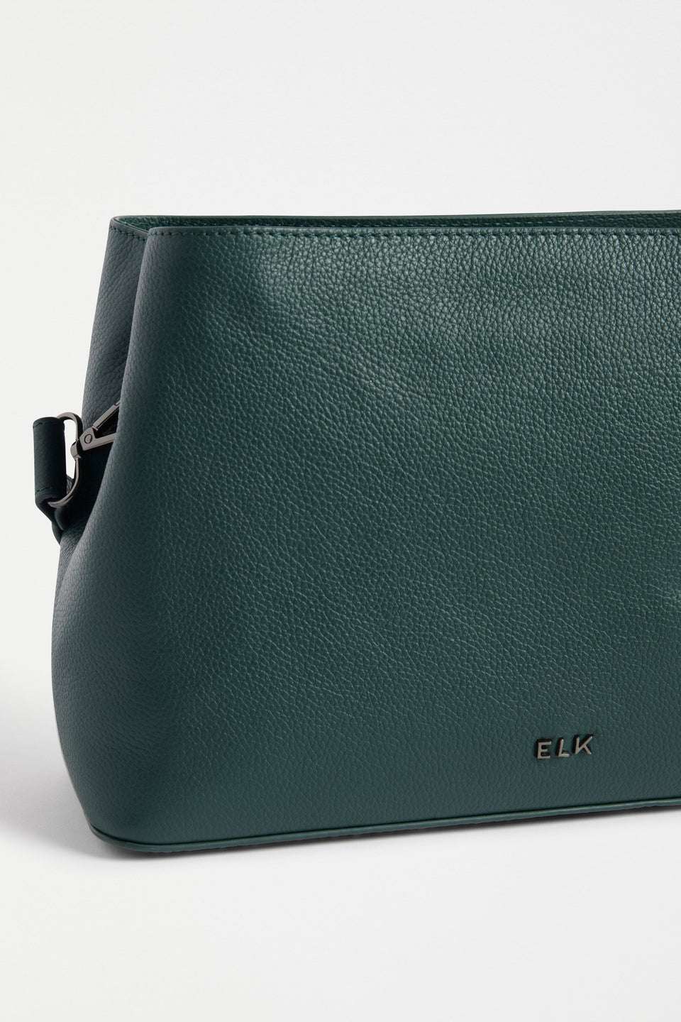 Niv Bag Flat Lay close up of material and elk logo | JASPER
