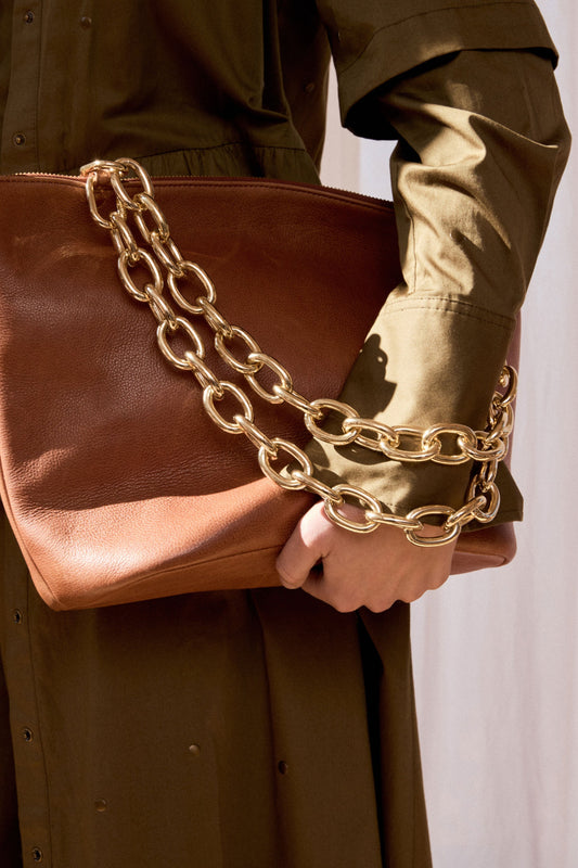 Lenkka Bag on campaign model styled with print and gold chain strap | TAN