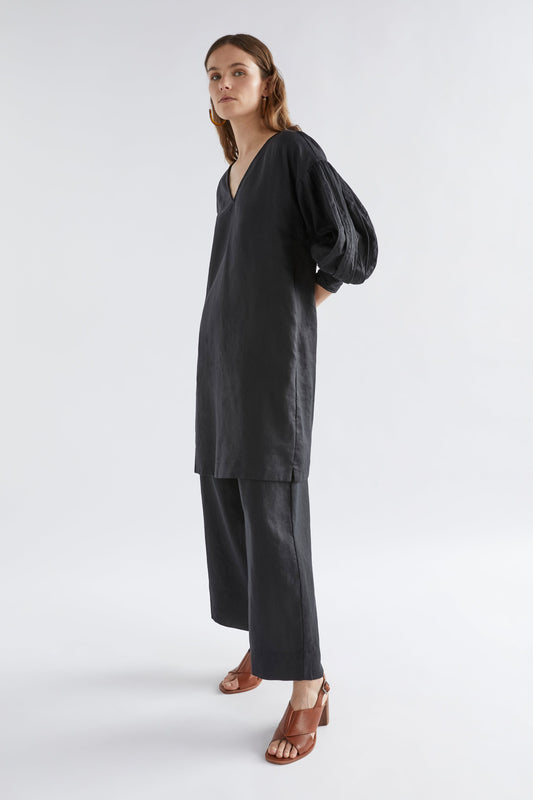 Vassa Linen Pleated Balloon Sleeve V-Neck Shift Dress Model Studio Angled Front | BLACK