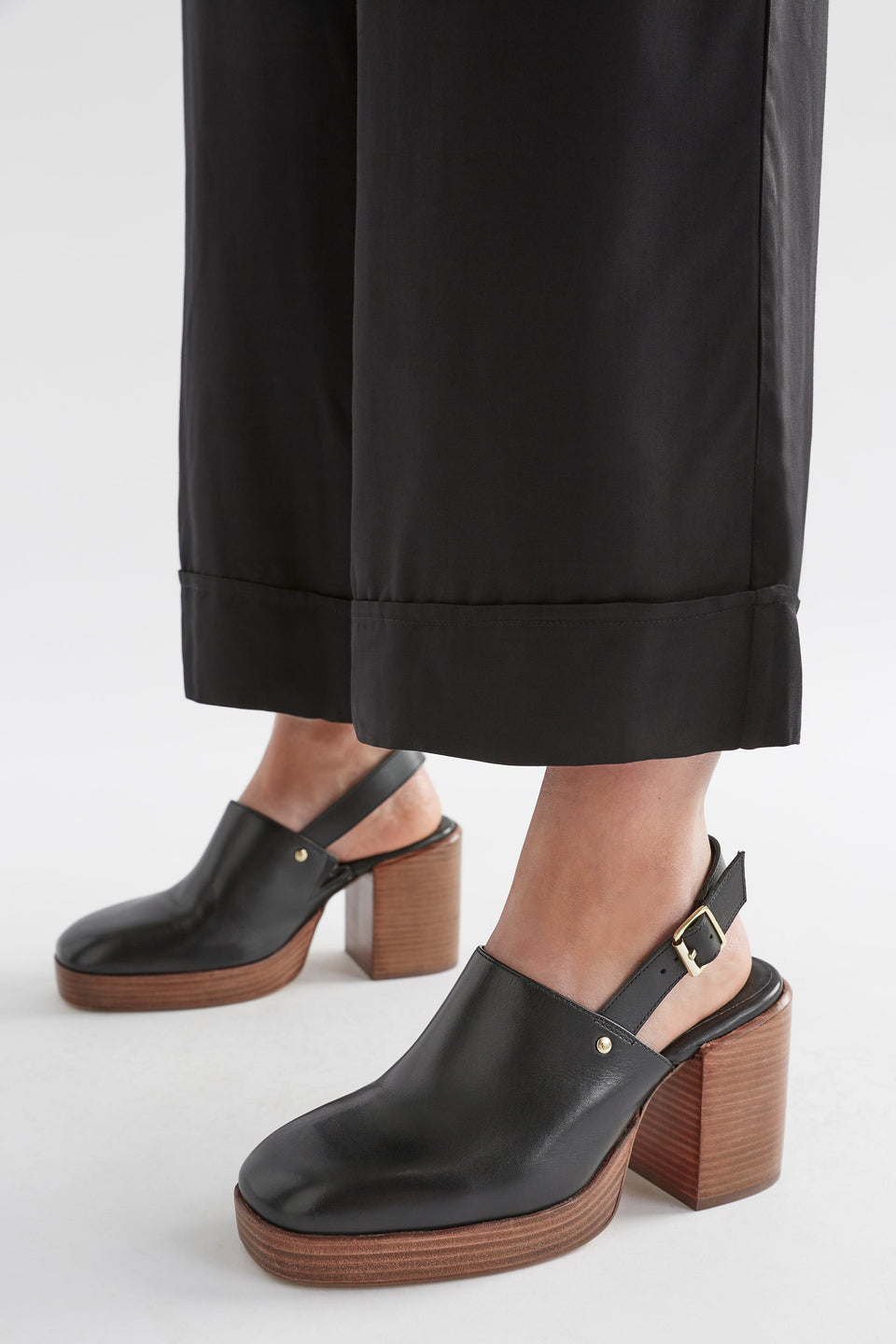 Stockholm Chunky Heel Slip on Clog with Back Strap Model Angled Front close | BLACK