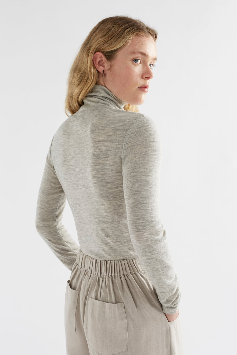 Merino Lightweight Long Sleeve Skivvy Model Angled Back | GREY