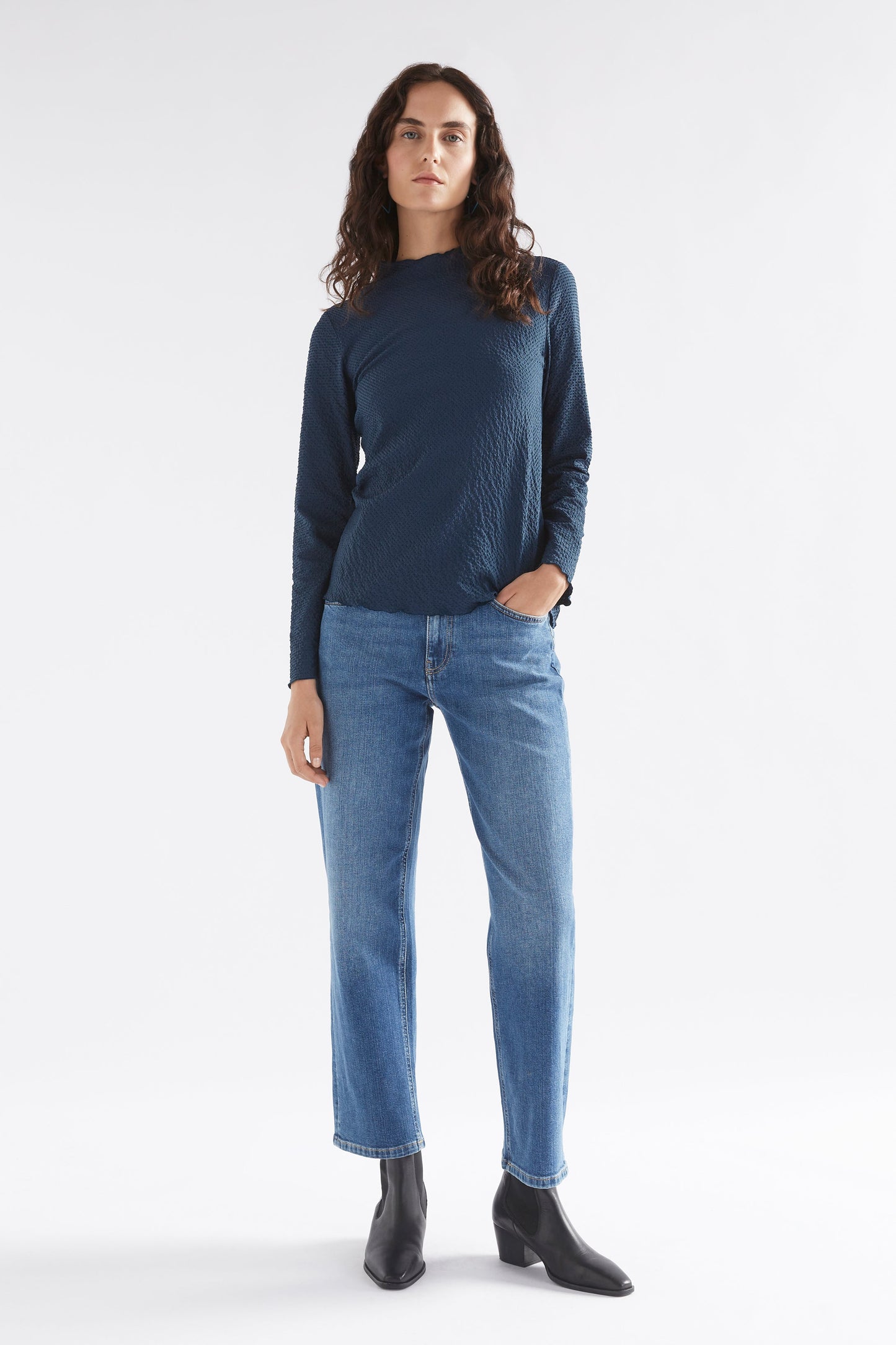 Deor Textured Mock Neck Lettuce Hem Long Sleeve Top Model Front Full Body | DEEP SEA BLUE