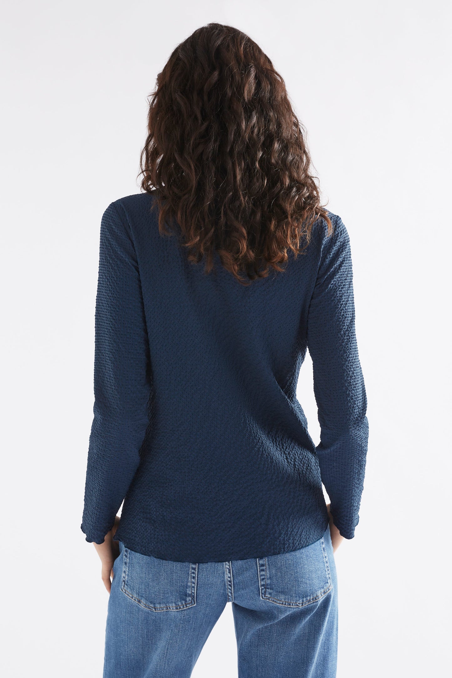 Deor Textured Mock Neck Lettuce Hem Long Sleeve Top Model Back | DEEP SEA BLUE