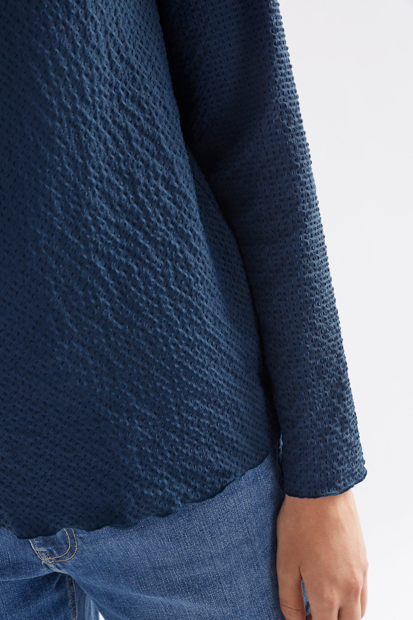 Deor Textured Mock Neck Lettuce Hem Long Sleeve Top Model Front Detail| DEEP SEA BLUE