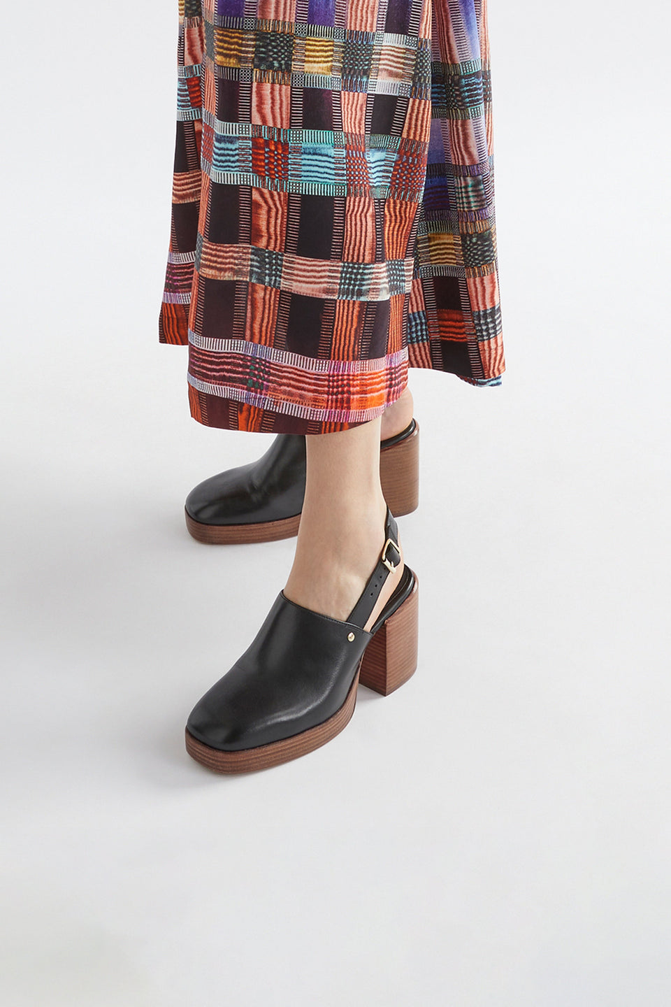 Stockholm Chunky Heel Slip on Clog with Back Strap Model Angled Front | BLACK