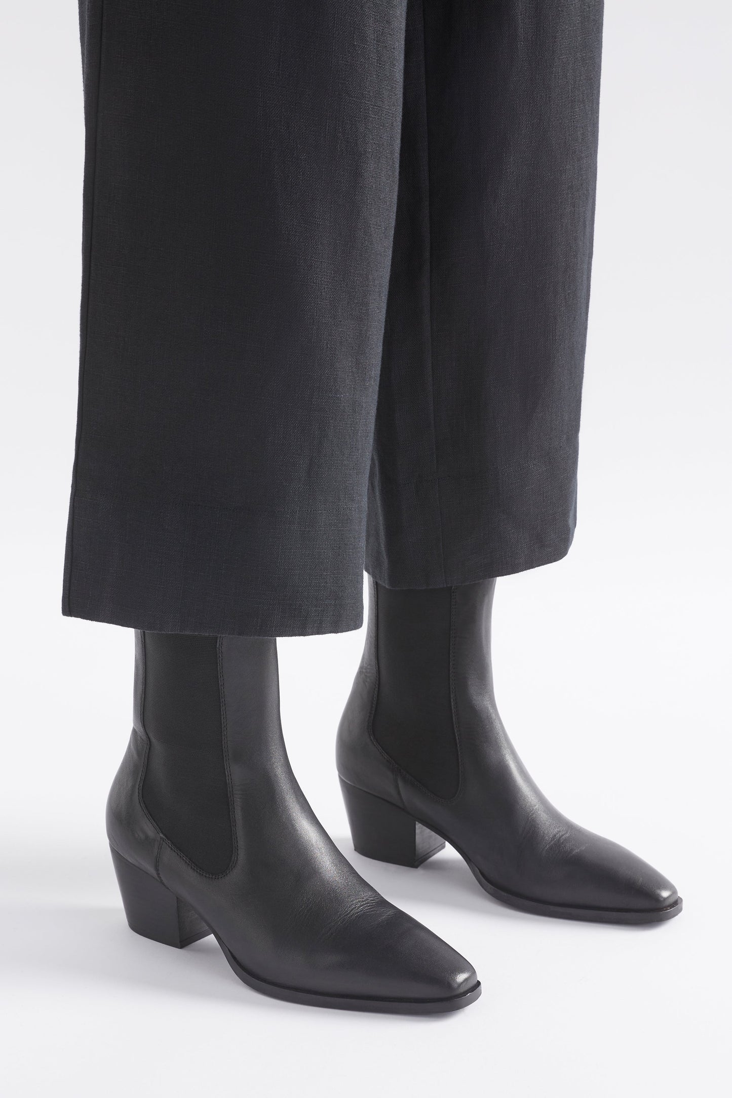 Vastra Pointed Square Toe Mid Heel Leather Slip on Boot Angled Front Model | BLACK