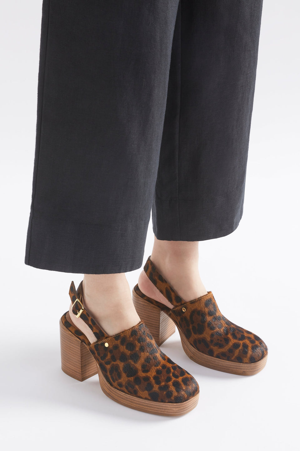 Stockholm Chunky Heel Slip on Clog with Back Strap in Animal Print Angled Front Model | ANIMAL PRINT