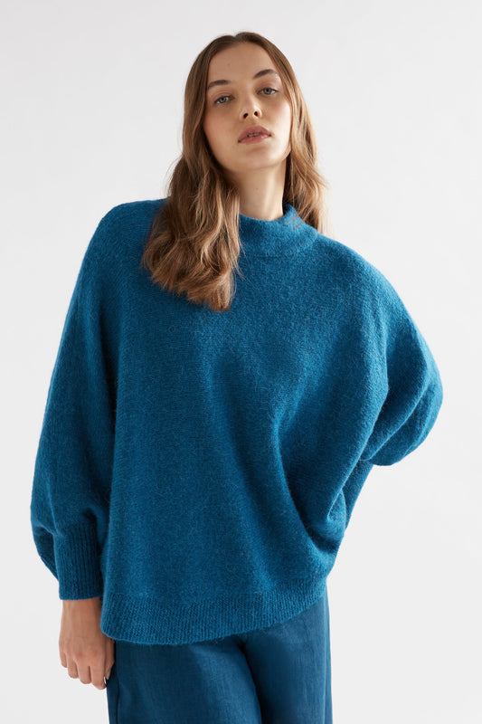 Palmen Alpaca Merino Mock Neck Sleeved Poncho Model Front 2 | PEACOCK