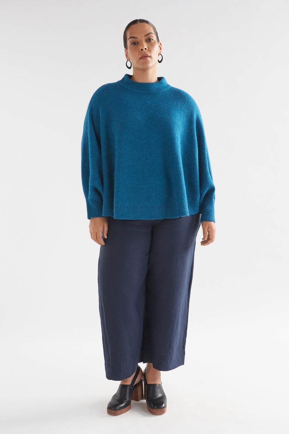 Palmen Alpaca Merino Mock Neck Sleeved Poncho Model Front full Body | PEACOCK