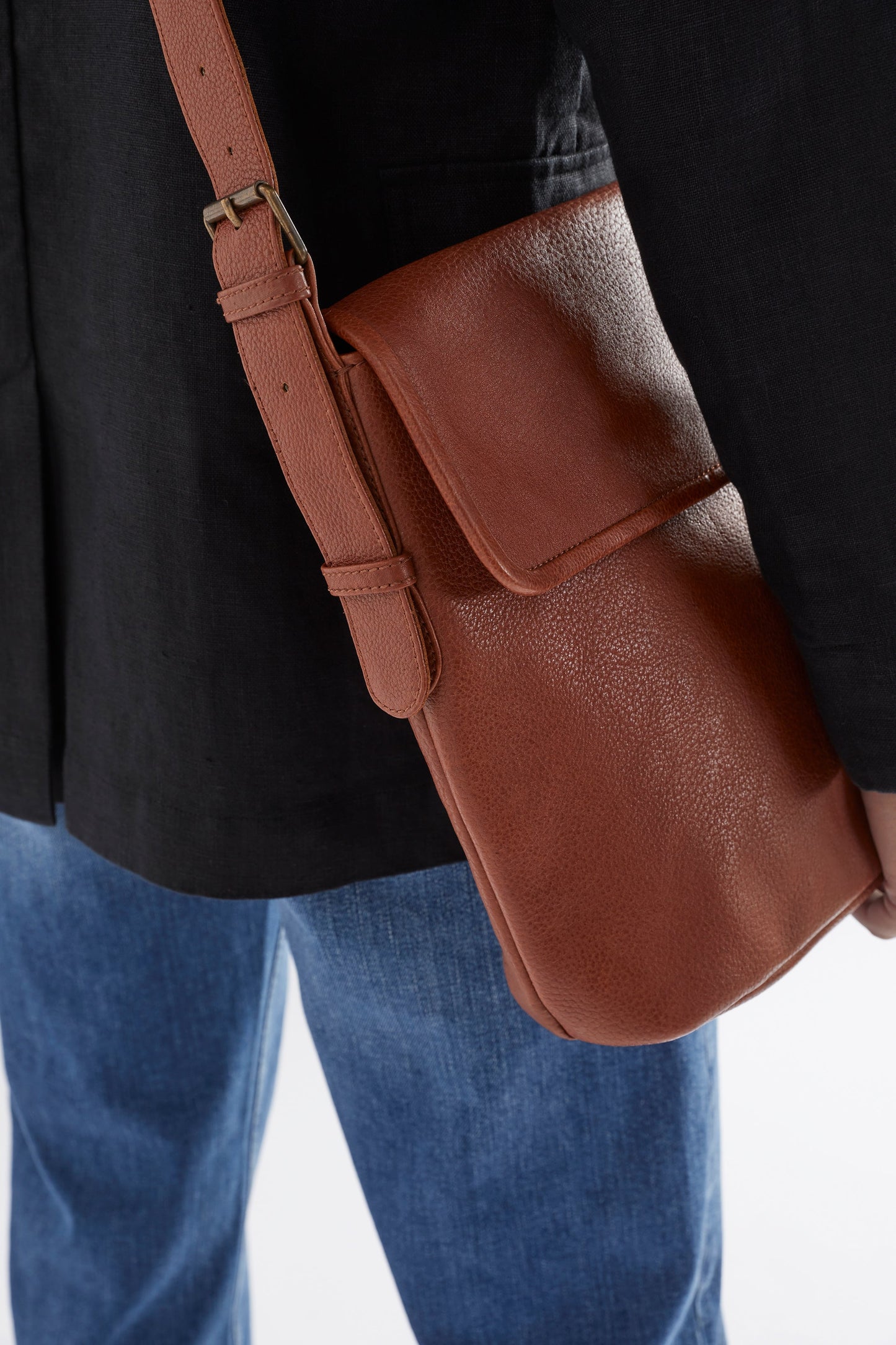 Teo Medium sized Leather Crossbody Bag with flap front detail TAN